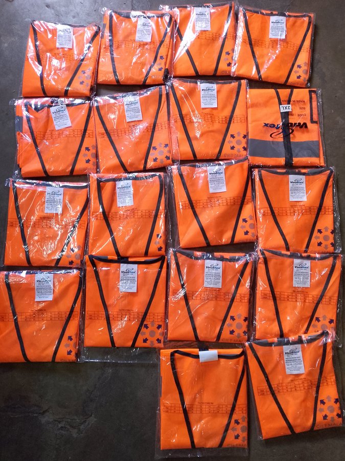 Branded high-visibility safety vests ready for distribution